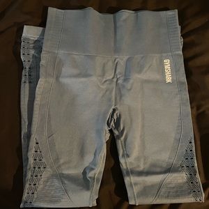 2 pair of Gymshark leggings for the price of one, light pink and blue leggings.